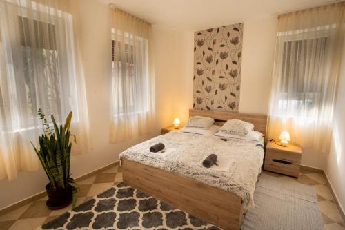 Posteľ alebo postele v izbe v ubytovaní Szitakötő Apartman