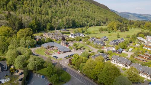 an aerial view of a village in the mountains at Mains of Taymouth Country Estate 5* Houses in Kenmore