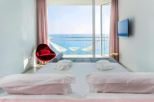 Hotel Aromarにあるベッド