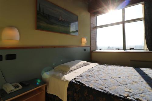 Una cama o camas en una habitación de Hotel SABO'