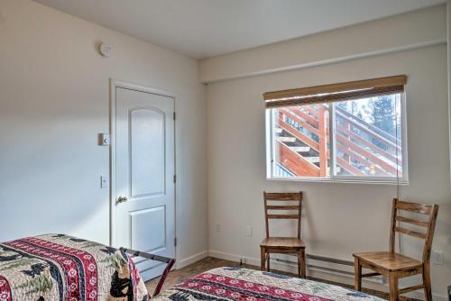 a bedroom with a bed and two chairs and a window at Homer Hideaway on Fritz Creekside - Pets Welcome in Homer
