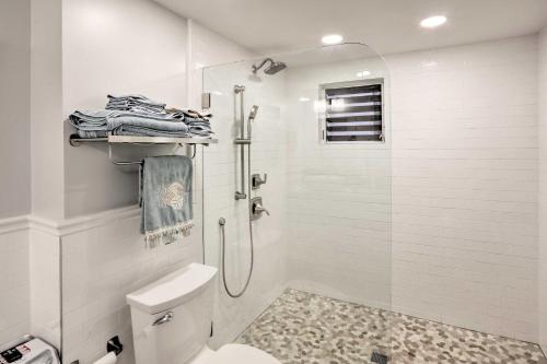 a white bathroom with a shower and a toilet at Tropical St Thomas Resort Getaway with Pool Access! in St Thomas
