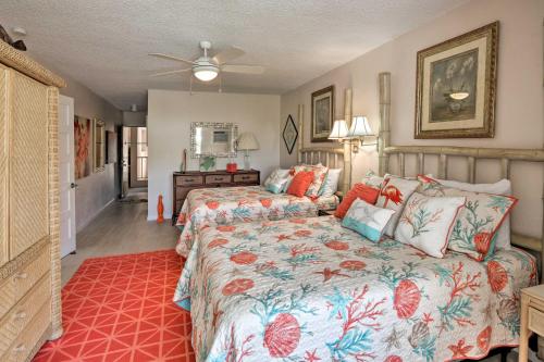a bedroom with two beds and a dresser at Tropical St Thomas Resort Getaway with Pool Access! in St Thomas