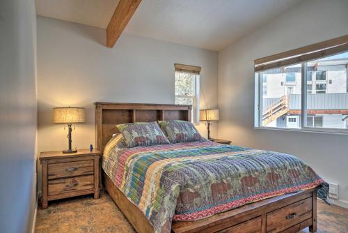 a bedroom with a bed and a window at Pet-Friendly Duplex with Northern Lights Aurora View in Homer