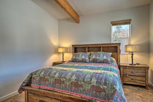 a bedroom with a bed and two lamps and a window at Pet-Friendly Duplex with Northern Lights Aurora View in Homer