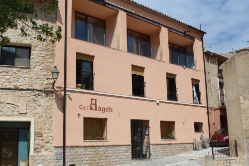 a building with a sign on the side of it at Ca L´Ángels in Prat de Compte