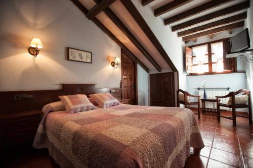 Ένα ή περισσότερα κρεβάτια σε δωμάτιο στο Casa Asprón