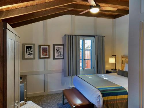 a bedroom with a bed and a window at Bright Angel Lodge - Inside the Park in Grand Canyon Village
