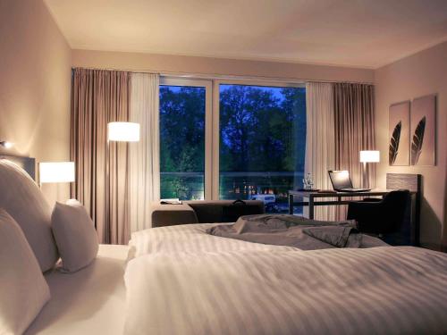 Кровать или кровати в номере Mercure Hotel am Entenfang Hannover