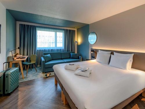 Postel nebo postele na pokoji v ubytování Novotel Zurich City West