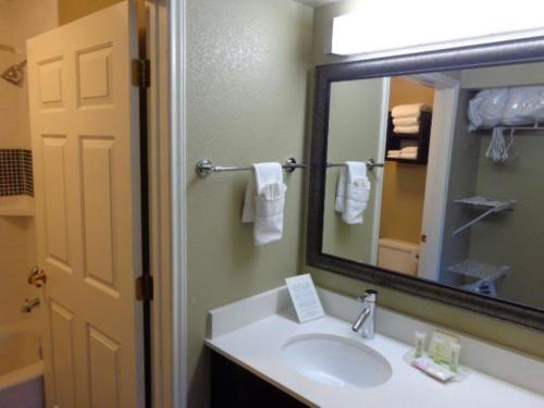 a bathroom with a sink and a mirror at Staybridge Suites Colorado Springs North, an IHG Hotel in Colorado Springs