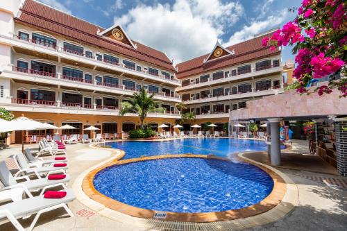 a swimming pool in the middle of a resort at Tony Resort in Patong Beach