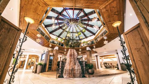 a view of the lobby of a building with a ceiling at Wellnesshotel Warther Hof in Warth am Arlberg