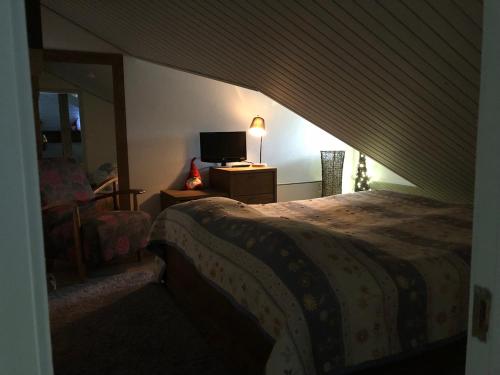 Uma cama ou camas num quarto em Saaritupa Apartment Saariselkä