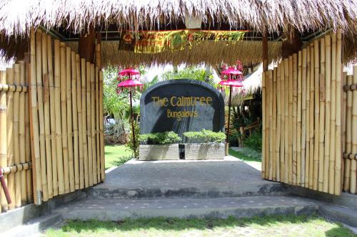 a gate to the entrance to the carribean british museum at The Calmtree Bungalows in Canggu