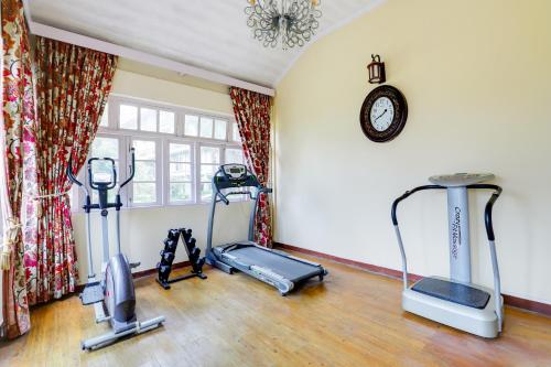 a gym with three exercise bikes in a room at Summit Barsana Resort & Spa in Kalimpong