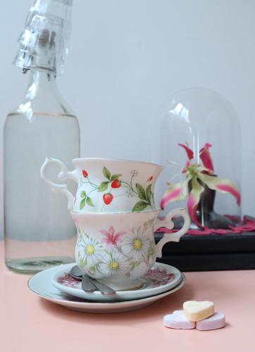 a tea cup and saucer on a table at Hostel ROOM Rotterdam in Rotterdam