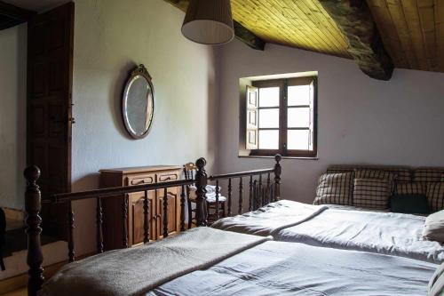 מיטה או מיטות בחדר ב-Casa de Aldea Casa de Isidoro