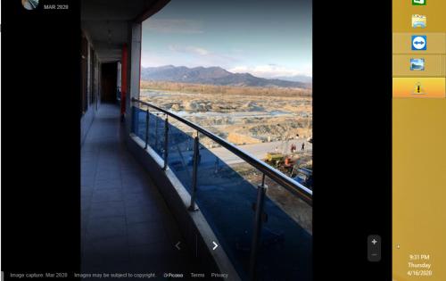 a balcony of a building with a view of a valley at Riverside Hotel in Mām Derai