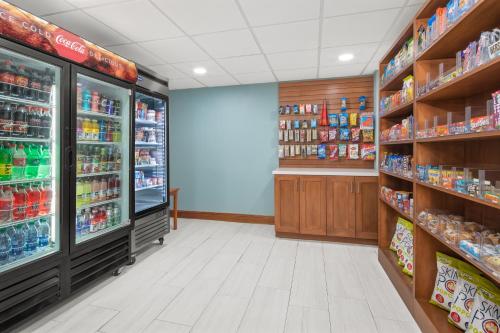 a store aisle with shelves of food and drinks at Holiday Inn Express & Suites - Hardeeville-Hilton Head by IHG in Hardeeville