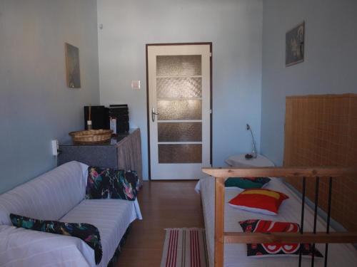 a living room with a couch and a chair at Apartmány Rossa in Louny