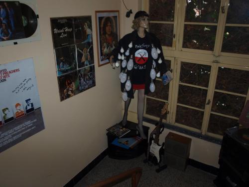 a statue of a person standing on a stand in a room at Apartmány Rossa in Louny