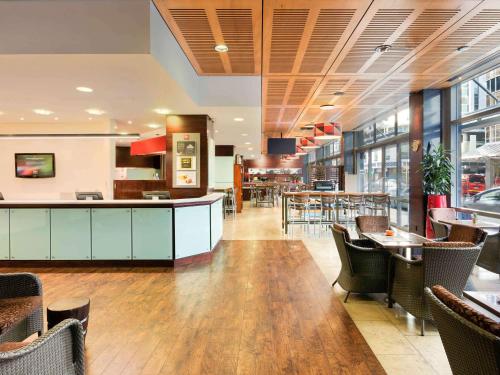a large kitchen with a large window at ibis Wellington in Wellington
