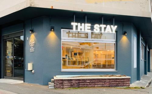 a store with a blue facade with thestay sign on it at THE STAY WAKKANAI in Wakkanai