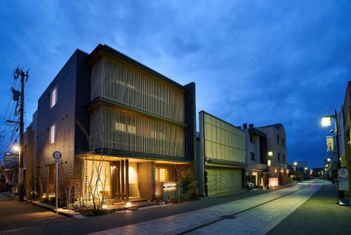 a building on the side of a street at night at 凜庵 LIAN_KANAZAWA in Kanazawa