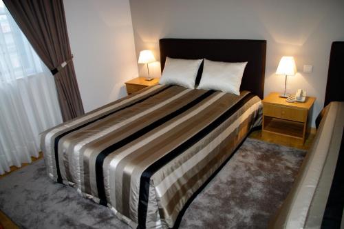 Ένα ή περισσότερα κρεβάτια σε δωμάτιο στο Hotel O Encontro