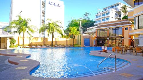 a large swimming pool in the middle of a building at Boracay Holiday Resort in Boracay