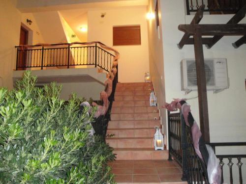 a staircase in a house with a stair case at Kandania Apartments in Kántanos