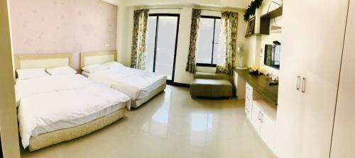 Ein Bett oder Betten in einem Zimmer der Unterkunft 民宿記 Min su ji