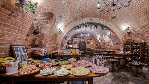 a room with a bunch of food on a table at Apartmány Pod Čerťákem in Dolní Moravice
