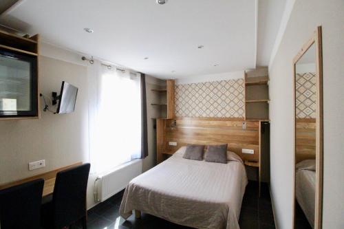 Cama o camas de una habitación en Hotel des Pyrénées