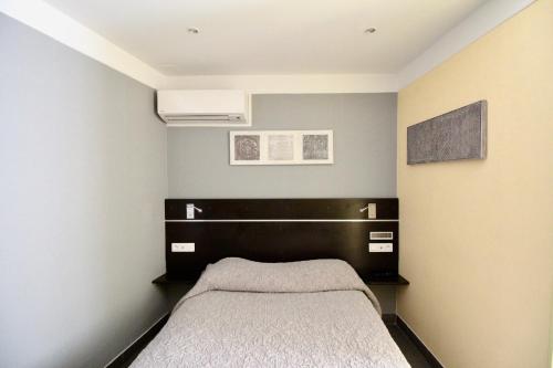Cama o camas de una habitación en Hotel des Pyrénées
