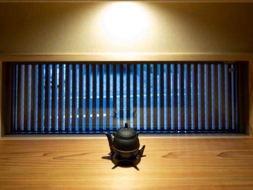 a bug sitting on the floor in front of a window at Hakata-no-Yado Tsurezure-Ann in Fukuoka
