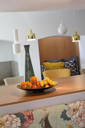 a plate of fruit sitting on a table at Águamel Sintra, Boutique Guest House in Sintra