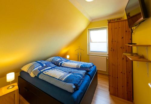 Postel nebo postele na pokoji v ubytování Ferienhaus-Butterblume