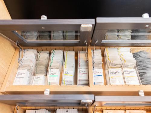 a drawer filled with lots of books at Super Hotel Okayama Station Higashiguchi in Okayama