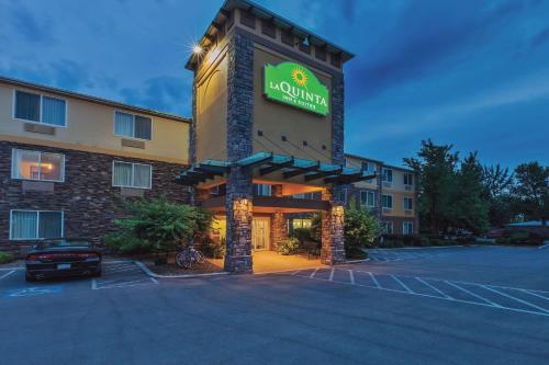 a hotel with a sign on the front of it at La Quinta by Wyndham Boise Airport in Boise