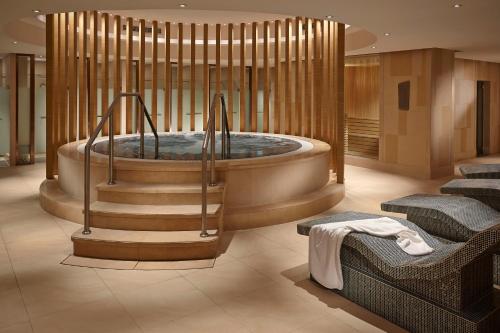 a bathroom with a jacuzzi tub in the middle at Kerry Hotel, Beijing by Shangri-La - 5 Kilometers to The Forbidden City in Beijing