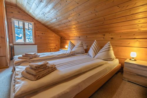 Ένα ή περισσότερα κρεβάτια σε δωμάτιο στο Chalet Weid