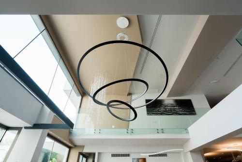 a ceiling fan hanging from the ceiling of a building at Saracen Sands Hotel & Congress Centre - Palermo in Isola delle Femmine