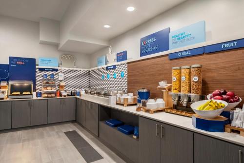 a supermarket with a counter with food on it at Holiday Inn Express Dumfries-Quantico by IHG in Dumfries