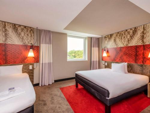 Postel nebo postele na pokoji v ubytování ibis Bern Expo