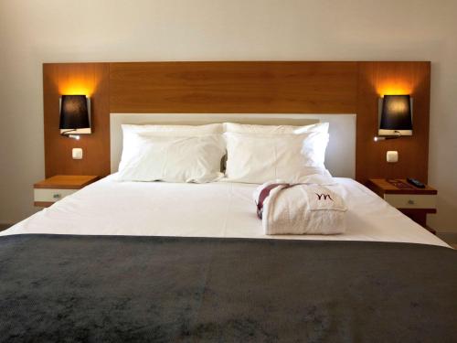 Postel nebo postele na pokoji v ubytování Hotel Mercure Lisboa