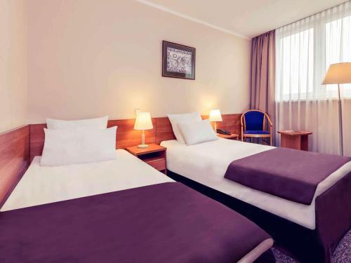 Łóżko lub łóżka w pokoju w obiekcie Hotel Mercure Toruń Centrum