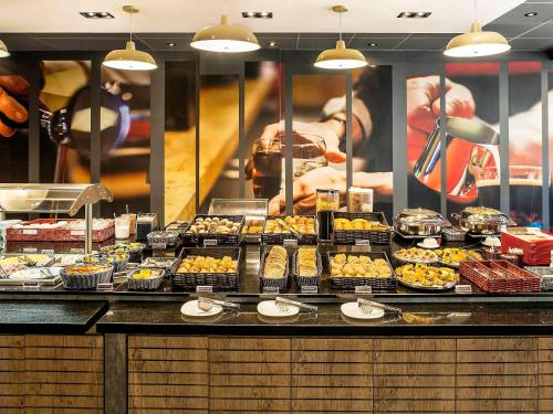 a buffet line with many different types of food at ibis Macae in Macaé