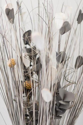 a vase filled with lots of tall grass at Villa du Macchione BASTIA by Location-tourisme-corse in Bastia